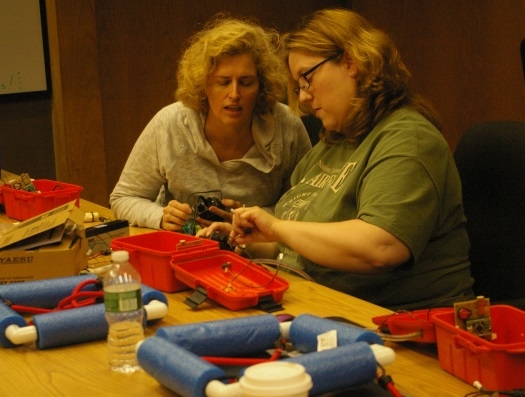 Two teachers are working together on a buoy collaboration inside ARRL in a Teachers Institute session.