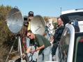It's amazing how hilltops attract ham radio operators during the 10 GHz contest.  While we were on Signal Peak in Orange County, two other carloads of hams showed up, resulting 
in this mini-convention.  Shown here are (from left):  <b>W6XD</b> (standing), <b>N6DN</b> (leaning over his equipment), <b>N9RIN</b> (in the background) and <b>AD6HT</b>.  <i>I'm behind the camera.</i>  Also not in the photo was <b>WA6CDR</b>, who was nearby with his portable six-foot dish.