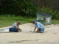 AD5JT and KD5MML assemble a 6 meter yagi. <i>photo by K5GWC</i>