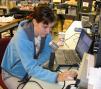 <b>Yvette, KB3HTS</b>, a fourth year physics major at CWRU scans the band at W8EDU.  <i>(W8WTS photo)</i>