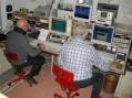 Mario I1ANP and Giorgio IK1UWL facing 2 receivers and 3 computers