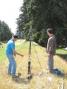 Hal, W7EC, and his assistant- Soren (a new ham without a callsign just yet) aims the Potato Howitzer to shoot a line over the 100 feet high fir trees.