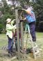 Diane-W7SIM and Armand-KA5BBG assemble one of the clubs two military surplus crank up towers. This one was used for the 20M PH Yagi. This station made 692 QSOs.