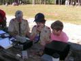 L-R Earl Wells (KZ4W) works a contact with Nicholas and John of Troop 91.