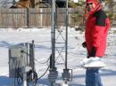 Gene Shea, KB7Q, of Bozeman, Montana, operated the 2009 ARRL 160 Meter Contest from the QTH of Todd Gahagan, WA7U, also in Bozeman. Shea clears the snow away from the base of WA7U's base-insulated 80 foot tower to make sure all 66 radials were still connected and ready to go. [Photo courtesy of Gene Shea, KB7Q]