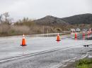 Flooding has caused damage and road closures across California like this road on Camp Pendleton. [LCpl. Mhecaela Watts, USMC, photo.]