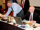 ARRL General Counsel Chris Imlay, W3KD (left) and ARRL Chief Executive Officer David Sumner, K1ZZ, review the day's agenda during the 2010 Annual Meeting. [Steve Ford, WB8IMY, Photo]