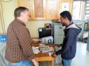 Bob Johnson, W9XY (left), teaches Morse code to one of the students at ET3AA. [Ken Claerbout, K4ZW, photo]