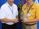 ARRL members Lou Dietrich, N2TU (left), and Hal Turley, W8HC, accept the German DX Foundation’s 2013 DXpedition of the Year award, for the K9W Wake Atoll Commemorative DXpedition. [Bob Inderbitzen, NQ1R, photo]