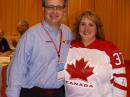 IARU President Tim Ellam, VE6SH, and ARRL News Editor S. Khrystyne Keane, K1SFA, had a friendly wager over the men's gold medal hockey game at the 2010 Olympic winter games -- the loser would have to wear the winning team's sweater at Dayton. Canada won the gold medal, so Khrystyne wore a Canadian hockey sweater (provided by Tim) on Saturday. [David Sumner, K1ZZ, Photo]
