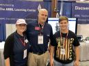 (center) ARRL Education and Learning Manager Steve Goodgame, K5ATA, shared strategies for drawing-in more youth to amateur radio. He's seen here with his wife and volunteer Cyndi Goodgame, K5CYN (left) and Hamvention Youth Forum speaker Cody Quarles, K0DIE.