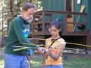 All ages and levels of experience are represented at the USA ARDF Championships. Medal-winner Bob Cooley, KF6VSE, explained the fine points to pre-teen newcomer Monique Beringer at Camp Concord last September.