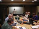 Dennis Dura, K2DCD (at the white board), leads a discussion on emergency communications.  Workshop sessions were held in the conference room at ARRL Headquarters. [Steve Ewald, WV1X, Photo]
