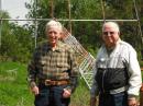 The author (left) and his brother Lyle, N3LM, before the quad antenna as it is today. He and his brother built this 72 foot tower that can be lowered using a homebrewed, permanently guyed 52 foot gin pole with a heavy duty worm gear driven hand winch at its base.