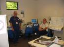 Cap Pennell, KE6AFE, and Allen Fugelseth, WB6RWU, during a calm moment in the radio room at the County Emergency Operations Center in Santa Cruz.