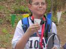 At age 12, Michael Bayern, W2CVZ, was the youngest competitor at this year's championships. He is getting a drink after his gold medal winning trip through the 80 meter course. [Joe Moell, K0OV, Photo]