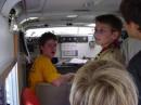 A very tired KU0DM (yellow shirt) demonstrates calling CQ during JOTA 2007 
inside of the county's SATERN trailer.
