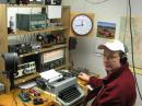 HN in the operating position at VA3HN on January 29, 2006. The Underwood Typemaster mill is sitting in a homebrew well cut into the desk. The transmitter in use (second shelf near the clock) is a QST homebrew 6V66L6 Long Feller (A Beginners Two-Stage Transmitter, QST, Jul 1946, pp 16-22, 126) on an 18 4 inch wooden chassis. The receiver is a 13 tube Eddystone 830/4 with an external audio limiter.