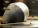 Inspection of the 160,000 cubic foot balloon after manufacture, a test conducted at the Hippodrome in St Paul, Minnesota. The white load tapes extend upward from the base, distributing the load into the balloon fabric, a coated nylon material. The upper region was coated with an aluminized paint to reduce the absorption of solar radiation and minimize heating of the helium gas. The balloon was inflated with air for this inspection.