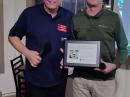 Mike Ritz, W7VO, presents Dr. Steve Hynal, KF7O, with the 2021 ARRL Technical Innovation Award during a Willamette Valley DX Club meeting in Portland, OR.