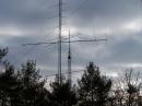 The antenna farm. In the foreground is our rotating 5 element yagi on a temporary Rohn 25 30 ft tower. In the background are two similar 5 element yagis fixed on a tower leg at 40 and 60 ft. They stayed south most of the time, but we could swing them manually to the west for E skip openings. The small antennas up above are 144 and 222 fixed yagis for VHF work.