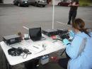 Melisa KE7KRS checking the radios to make sure everything is working like it should.