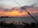 Sunset View of the Atlantic Ocean with the Balcony Mounted Buddistick antenna at KP4MD/P in Puerto Rico. 
Greyline Propagation time!