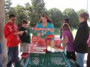 Kids love pizza.  Pam KF5JXO helping us out.