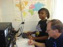 Harper KE5YZB working with Deavane who stayed after school to make more contacts and help out.