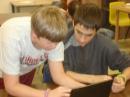 Tristan KF5NNP working with Bryan on an electronics project.
