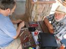 Dan, N0BAF, and Don, N0YE, working on the vertical matching network