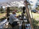 Oz Degennaro ACØIF logging while Allen Bishop KØARK 'runs them' on the SSB station. The ATV camera monitors them and is broadcast to the Betasso Shelter where the ATV is being demonstrated.