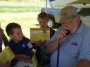 ARRL WY Section Manager Garth Crowe, N7XKT with kids and their ham radio passport