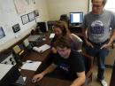 W0QQQ Members Nick Warren and Jill Drake, KM6UWL call CQ on 20 meters while Secretary/Treasurer David Yoder, KA0JMP supervises the proceedings.