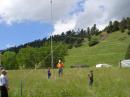 ARRL Rocky Mountain Vice Director Dwayne Allen, WY7FD getting the RTTY dipoles up with a little help from Hunter, a cub scout and club kid Ramsey with dad John, KF7GSA looking on.
