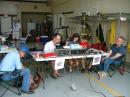The GoTA operating postion. AD5JT is on the left. KD5MMM helps some young visitors complete some contacts. <i>photo by K5GWC</i>