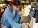 Yvette, KB3HTS, a fourth year physics major at CWRU scans the band at W8EDU.  <i>(W8WTS photo)</i>