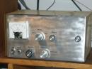 Updated transmitter with new front panel, labels, and perforated covering.