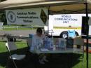 SPARC (Shore Point Amateur Radio Club) club member Peter Freiler, W1AIR, takes a break in the shade of the Public Information Tent awaiting the start of official set-up, West-Walk beach walkway, Savin Rock Park, West Haven, Connecticut. 
06/27/2009