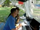 Dexter Schnebly, KB0YWM watches as a visiting ham contributes another 15m contact.