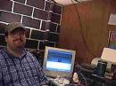 Chuck K8CPA at the Operating position at his home. Ugly ol' duffer, ain't he? 8-P