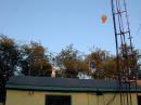 Weather balloon up about 150 feet. You can see the 3 element tri-band beam just about the roof line. Perfect weather too!