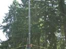 The W7DK tower crew puts the finishing touches on one of the 20 meter Yagis. The Yagis are held up in the air with Army Surplus Crank Up towers.