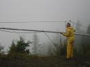 Johnny, KE7V, Putting up the 9 element 6M monster in the heavy rain.