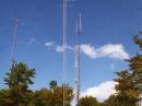 The front building is the shack, the rear building houses a 2m and 440 FM repeater (note the vertical antennas). In the fore ground is the tower with the 6m stack, 5 over 5 at 90 feet, with 22 el 222 beam on top of the tower at 105 feet. On the rear tower is the 2m FM beam fixed towards Pittsburg, PA.