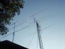 Ants at KM5PO. On the left, top to bottom is 50, 222, 144 backup and on the right is the 70' tower with 4x2M18XXX, 9WL 432, and 4xHO 144 mhz loops.