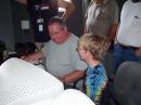 John, W9WY and a youth preparing to make his first contact.