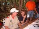 One of the local scouts talking with a scout in Maryland as George-WN4LTY looks on.