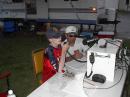 Pete Harrison, AA1PL, guides Jesse Perry, a young visitor, through a HF contact at the GOTA station.