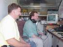 Paul KCØDDZ (L) and Eric ABØWA in the VHF/UHF station trying to figure out how to turn on a 6 meter opening.